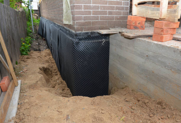 Happy homeowners after waterproofing job in Two Rivers